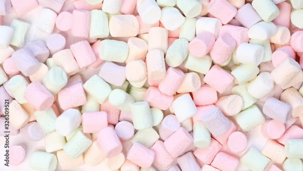 Top View of Pastel Shaped Marshmallow Candies with Some Scattered on the Pale white Table Top View of Pastel Shaped Marshmallow Candies with Some Scattered on the Pale white Table