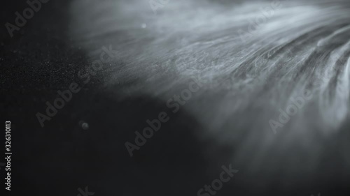 Smoke slow motion on Black background abstract