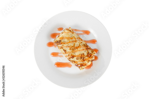 Canvas Print Pancake sweet stuffed with berry decoration, strawberry topping, on a plate isolated white background
