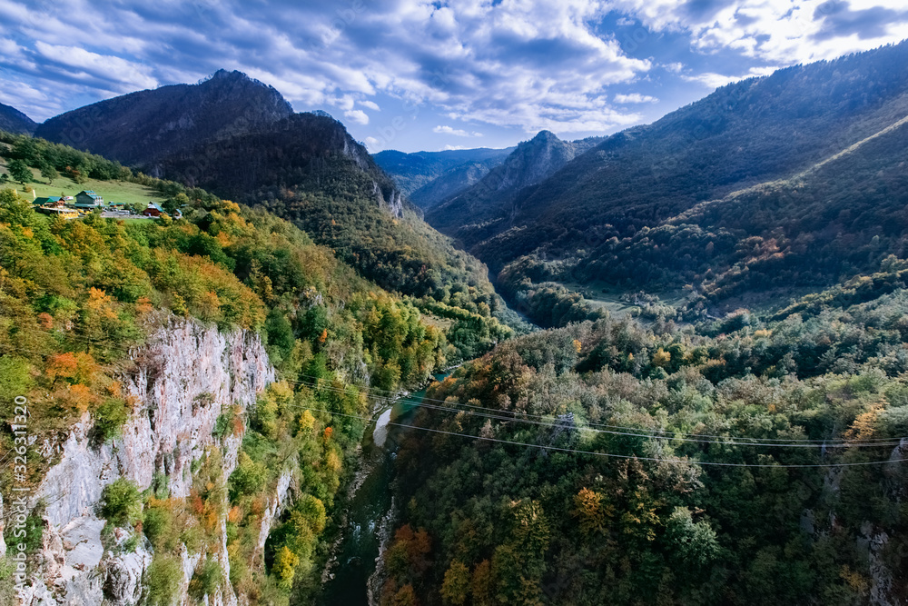 Green mountain panorama with steep cliffs, mountain peaks, river Tara and  mountain horizon. Montenegro canyon in Durmitor national park