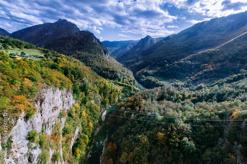 Green mountain panorama with steep cliffs, mountain peaks, river Tara and mountain horizon. Montenegro canyon in Durmitor national park