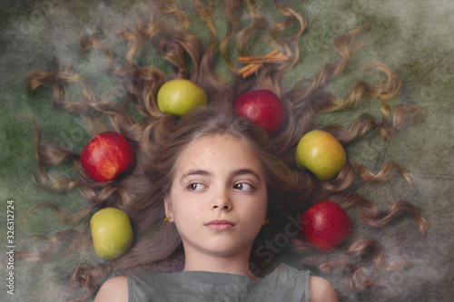 Image of a beautiful girl with apples in her hair
