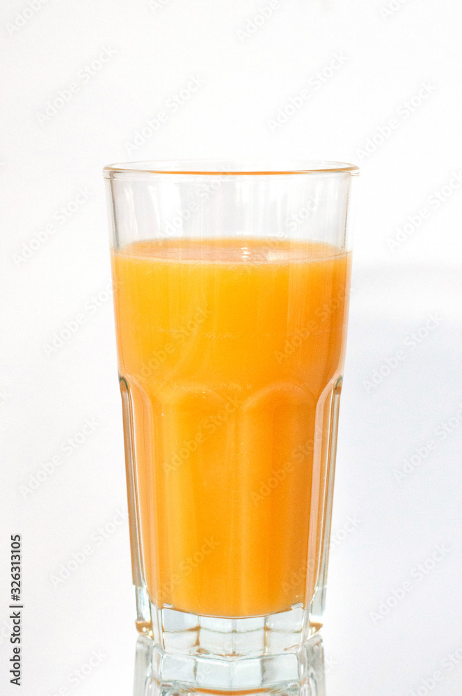 Orange juice glass, isolated on white background, vertical format
