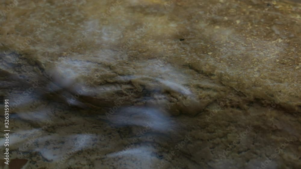 Blue sky reflects on the surface of a weak stream of water Blue sky reflects on the surface of a weak stream of water