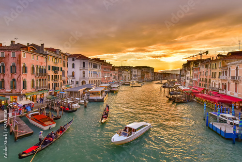 The Grand Canal with gondola and vaporetto at sunset time, Venice, Italy © momo11353