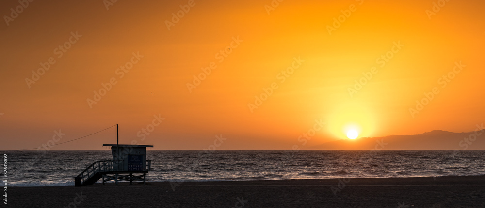 Sunset on the beach in California, Coast Guard rescue shed