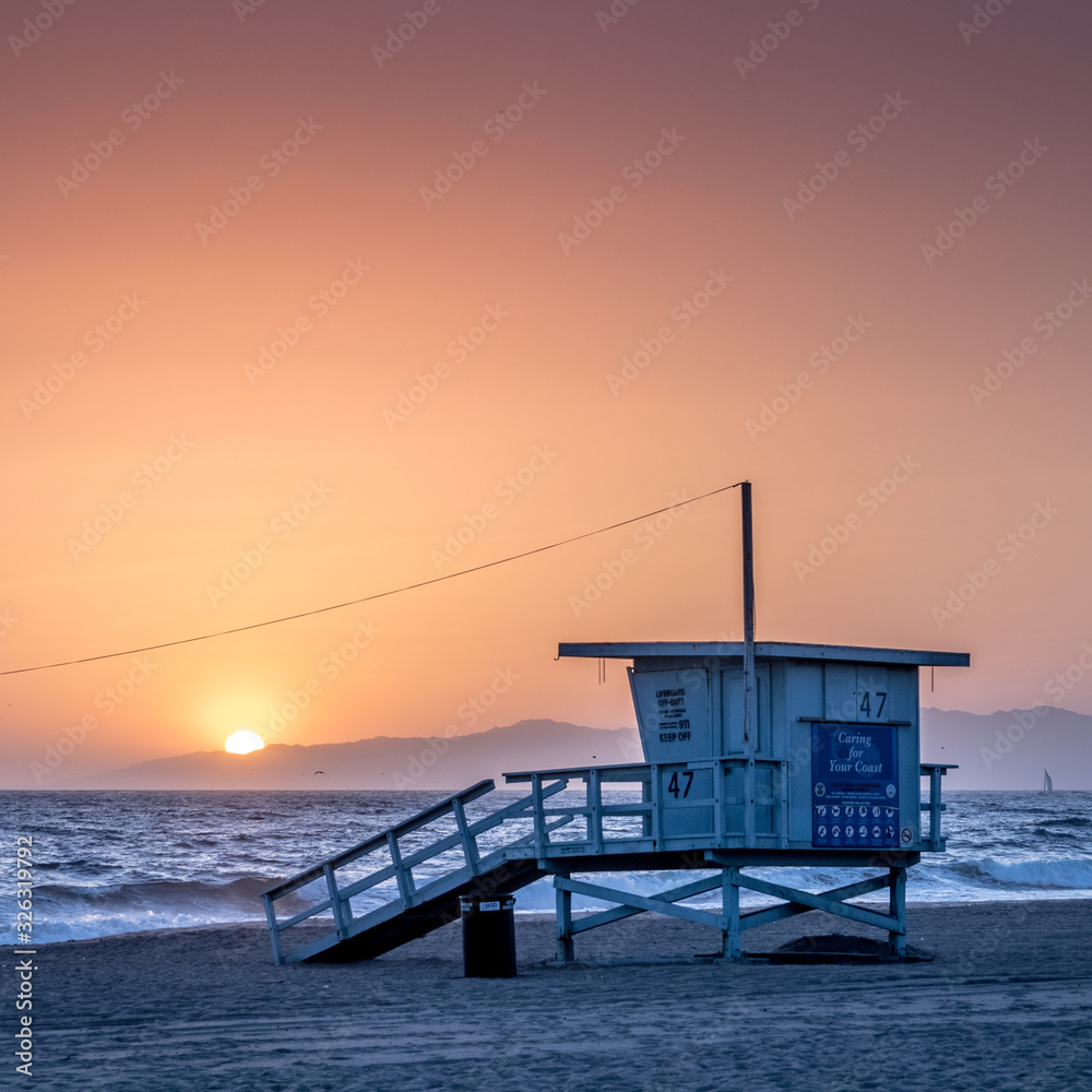 Sunset on the beach in California, Coast Guard rescue shed Sunset on the beach in California, Coast Guard rescue shed