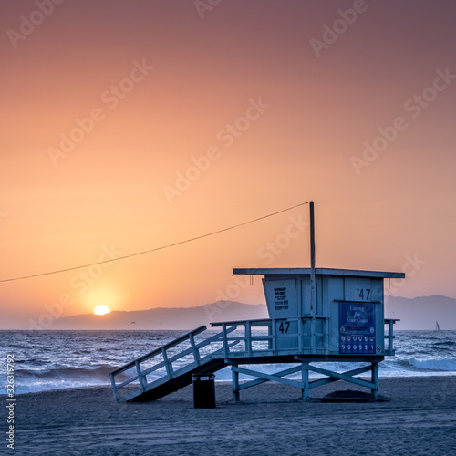Sunset on the beach in California, Coast Guard rescue shed © Lukas