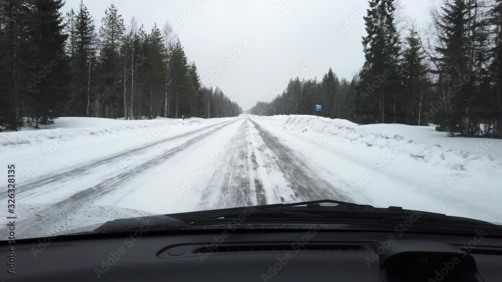 Driving a car on slippery road in winter, Finland Driving a car on slippery road in winter, Finland