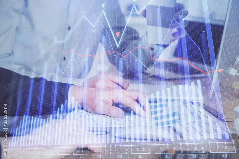 Multi exposure of chart with man typing on computer in office on background. Concept of hard work. Multi exposure of chart with man typing on computer in office on background. Concept of hard work.