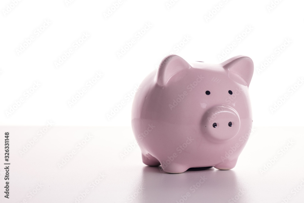 Pink pig piggy bank on a white background. The concept of savings and savings, financial management Pink pig piggy bank on a white background. The concept of savings and savings, financial management