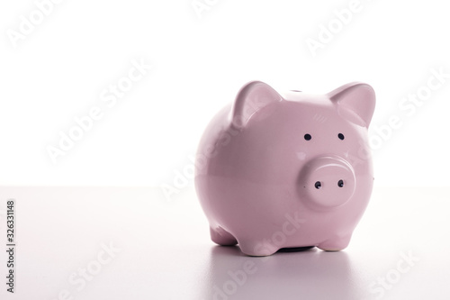 Pink pig piggy bank on a white background. The concept of savings and savings, financial management