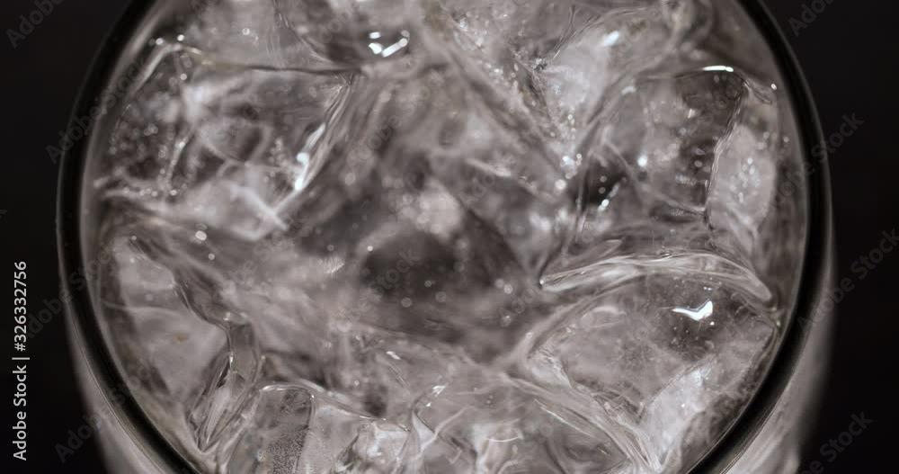 Ice cubes in Glass beverage Macro shot closeup Top view Ice cubes in Glass beverage Macro shot closeup Top view