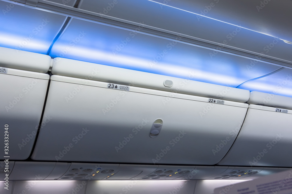 Closed luggage racks for hand luggage in an airplane.