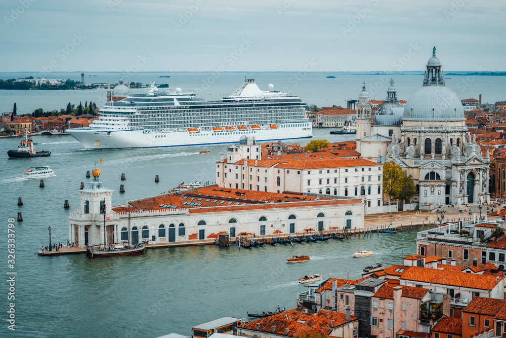 Venetian aerial cityscape view of Basilica Santa Maria della Salute from San Marco Campanile. Venice, Italy. Cruise ship floating in lagoon