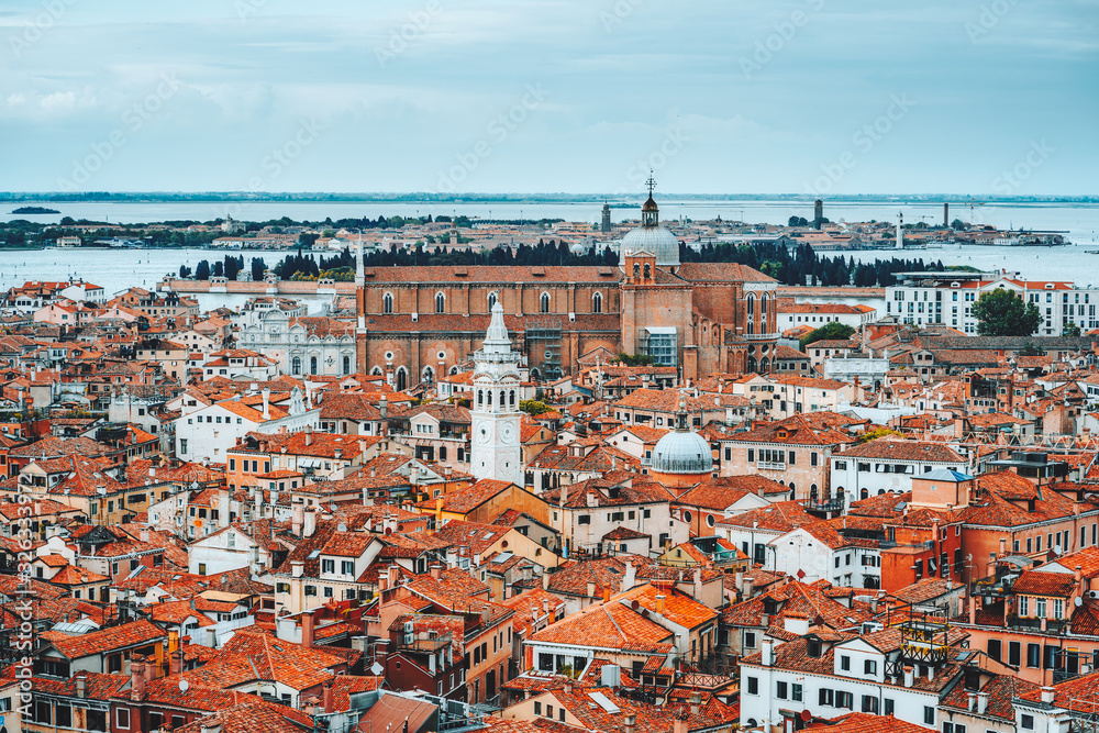 Panoramic view over rooftop of Venice, Italy. Traditional old houses with orange tiles