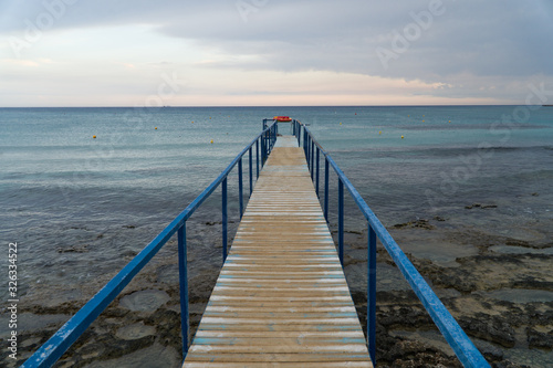 Old wooden pier leading to the sea on Cyprus.