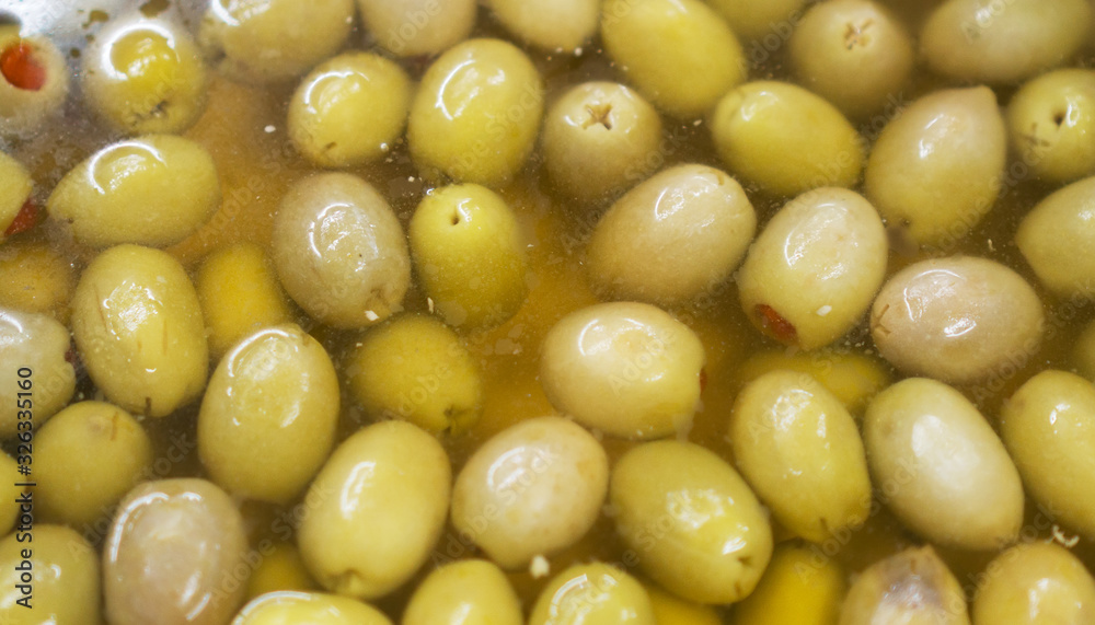Green olives in brine in supermarket. Green olives in brine in supermarket.