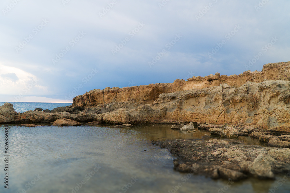 Beautiful lava stones on the Cyprus seashore.