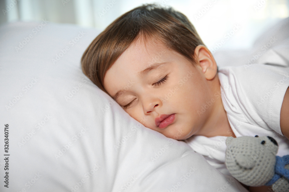 Cute little baby sleeping with toy at home. Bedtime Cute little baby sleeping with toy at home. Bedtime