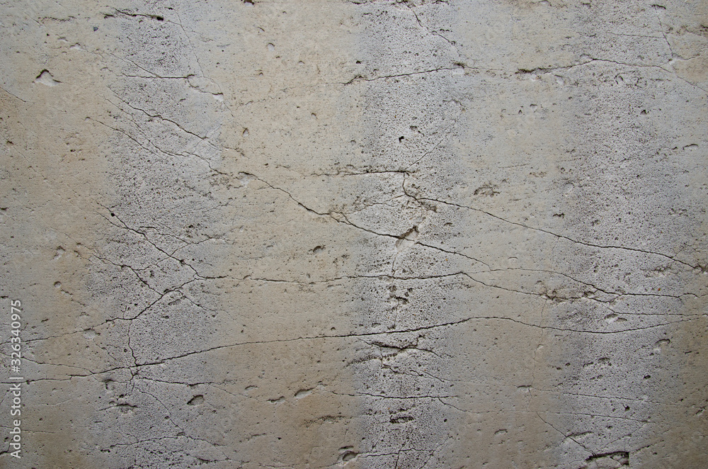 Abstract background. Old rough texture, gray concrete wall with cracks and stripes. Structure, background.