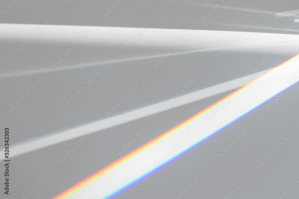 Blurred overlay effect for photo and mockups. Wall texture with organic drop diagonal shadow and rays of light from window on a white wall. Refraction optical effect.
