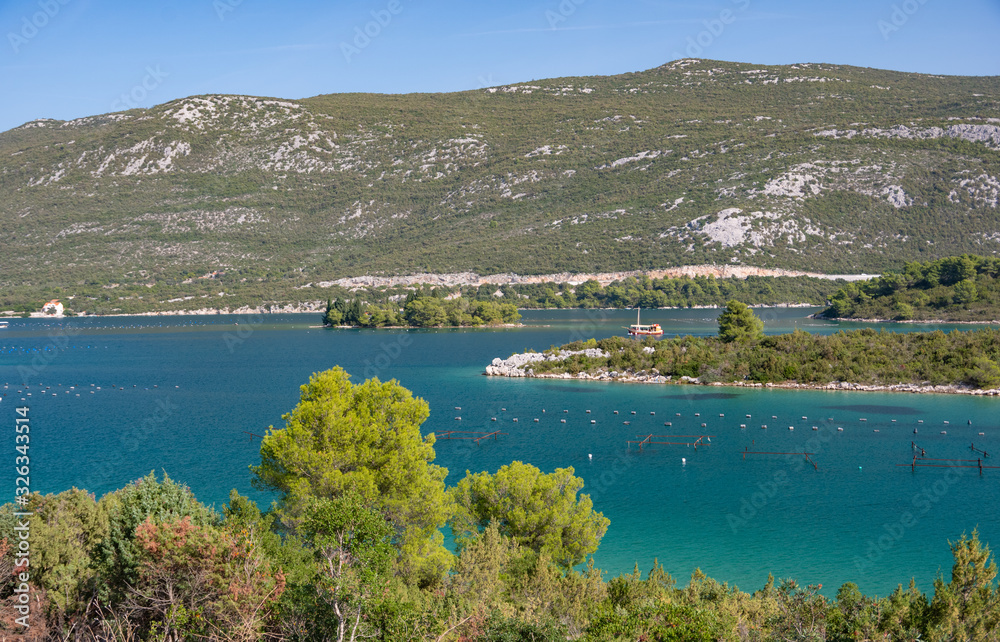 View of the azure sea bay with oyster farms. Croatia.