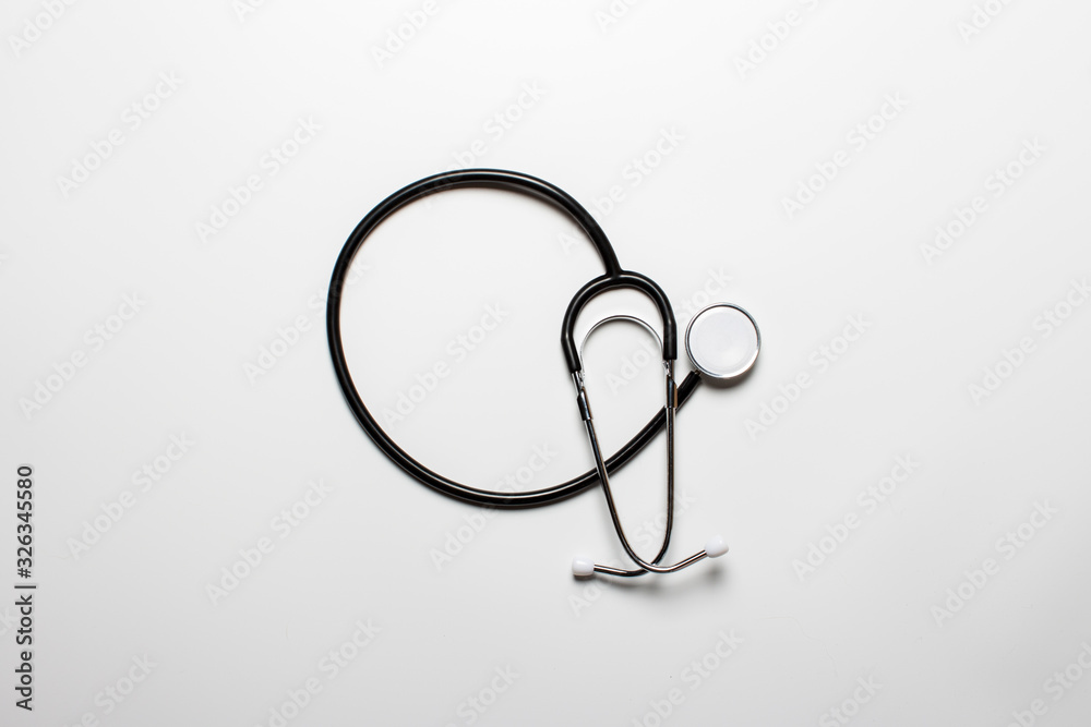 Doctor's stethoscope on a light background. Banner. Flat lay, top view Doctor's stethoscope on a light background. Banner. Flat lay, top view
