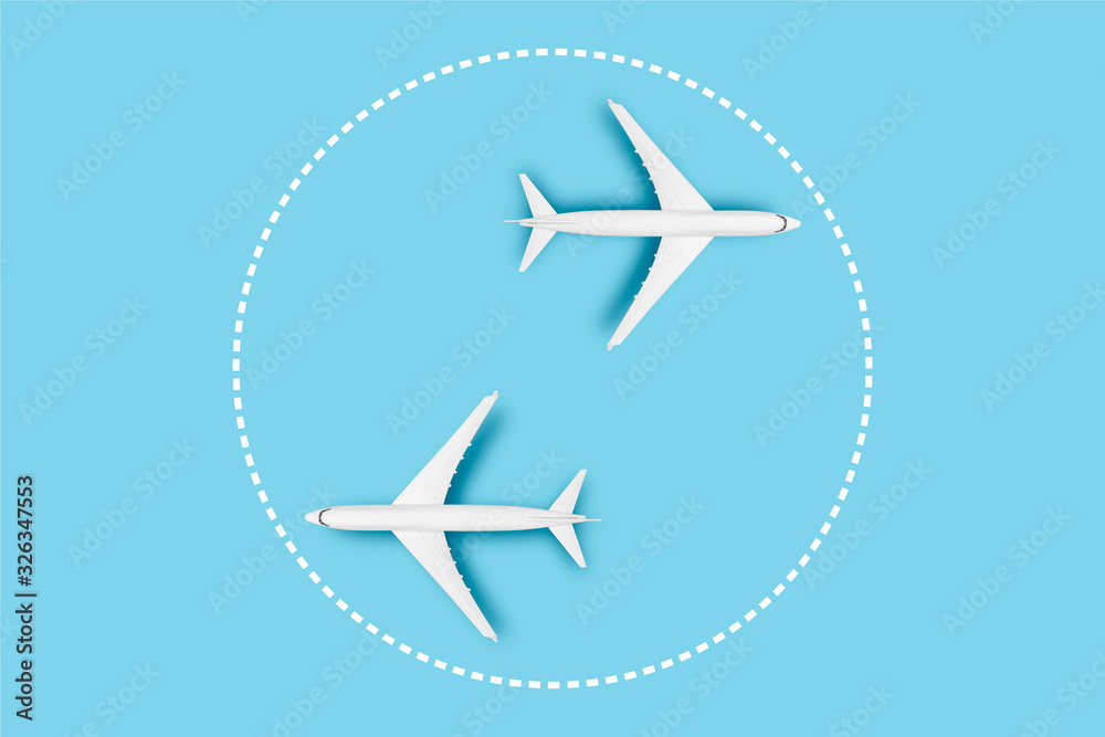Two Airplanes on a blue background. Concept travel, airline tickets, flight, pallet route, transfer. Banner. Flat lay, top view