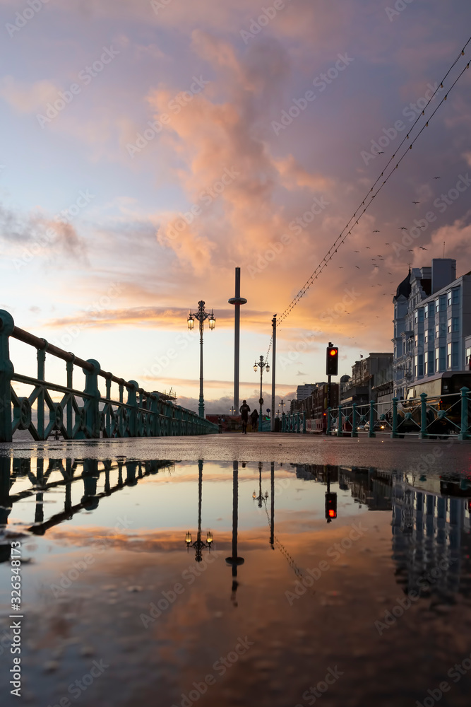 Brighton's i360 reflected in a puddle