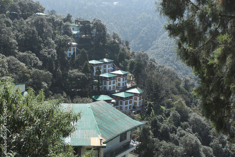 View of Hotel Omkar  and dense forest from Shedup Choephelling Buddhist Temple, Mussoorie, Uttarakhand, India