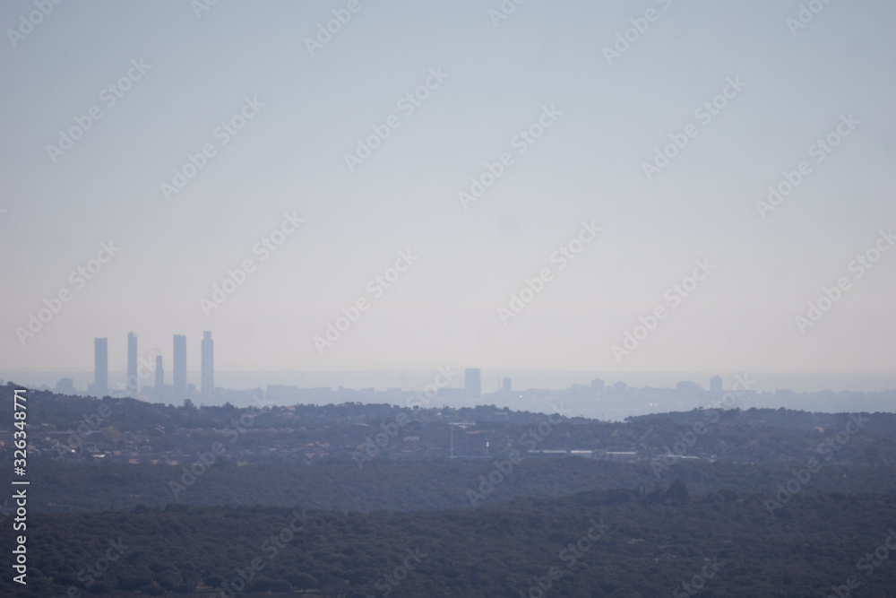 Panoramic view of Madrid (Spain) and pollution cloud from the distance