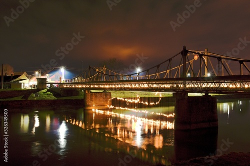 Historic iron bridge at night