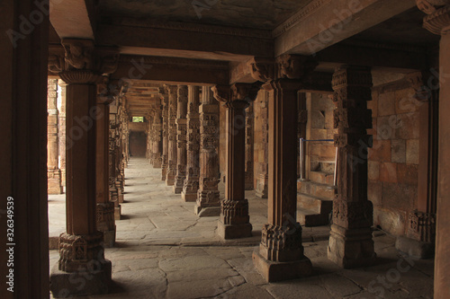 Cloister columns in the quwwat ul-islam mosque at Qutub Minar complex, Delhi, India photo