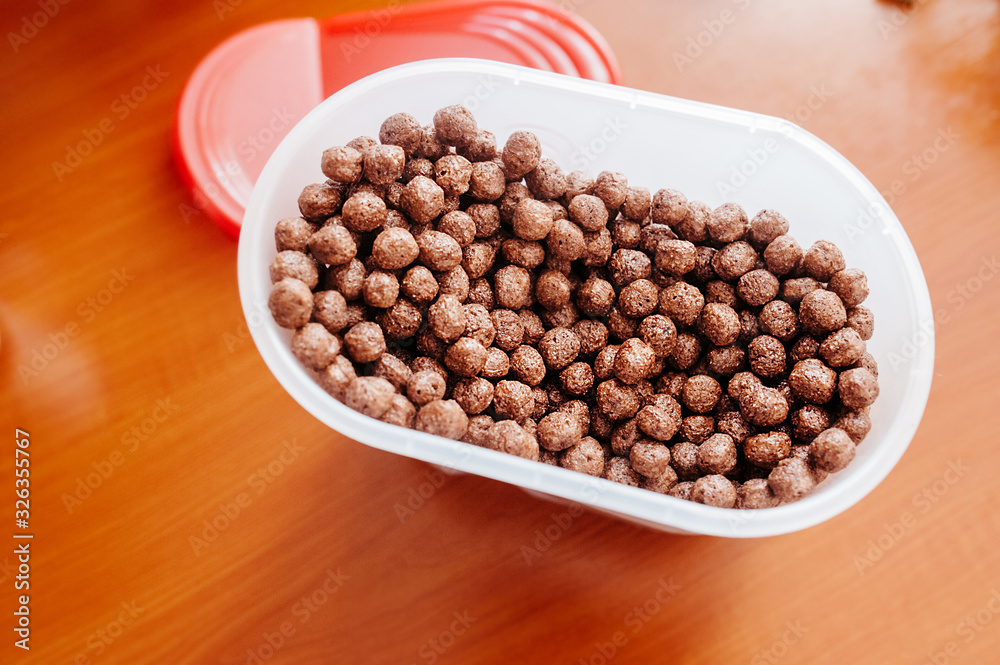a full jar of chocolate flakes with Breakfast balls. Children's Breakfast option. Ingredients for cooking. a full jar of chocolate flakes with Breakfast balls. Children's Breakfast option. Ingredients for cooking.