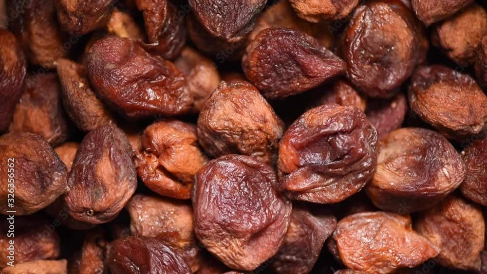 Homemade dried apricots on rotating background. Dried fruits background. Vegan, vegetarian diet. Healthy lifestyle. Fresh sweet apricot texture, organic food. Food ingredient background. Homemade dried apricots on rotating background. Dried fruits background. Vegan, vegetarian diet. Healthy lifestyle. Fresh sweet apricot texture, organic food. Food ingredient background.