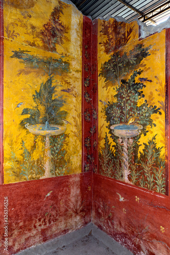 Oplontis Villa of Poppea - On the walls are represented, on a yellow and red background, gardens with beautiful fountains, photo