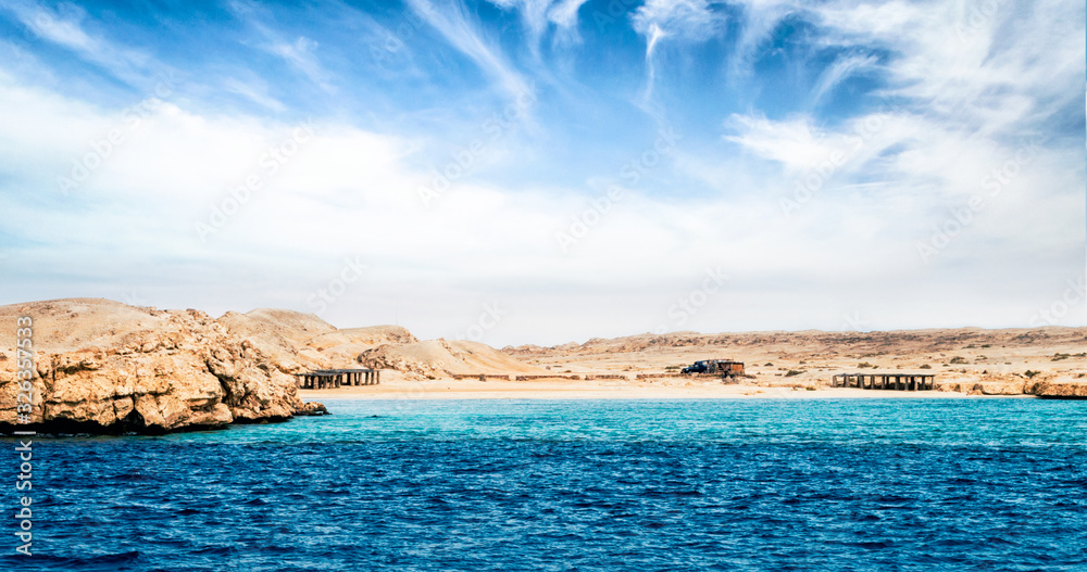 rocky coast of the Red Sea and.blue sky with clouds