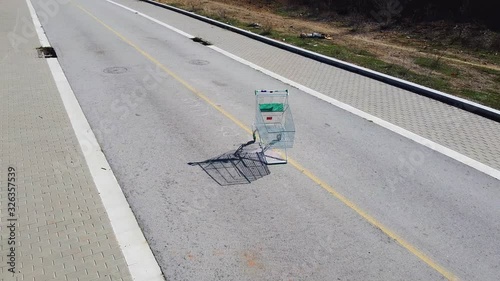 Circular drone shot of shopping cart on a road  photo