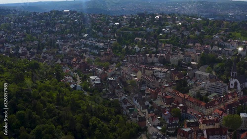 Aerial around the Gaisburg hill in spring  in Stuttgart, Germany. Pan to the left across the Heusteigviertel. photo