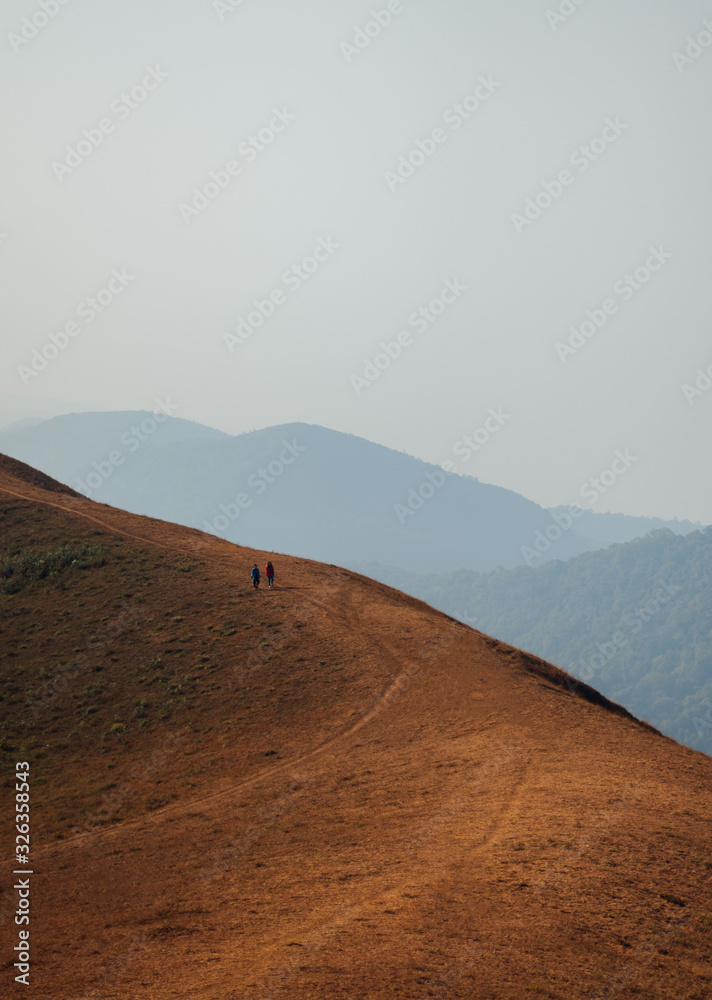 Fototapeta premium Two man on Mon Jong Trekking Route in Chiangmai, Thailand