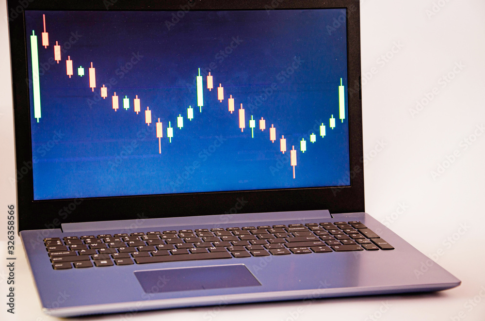 Trading on the exchange. Laptop on screen graph. Notepad pen rates, stocks. Win, lose. Good luck and failure in trade. Focus on laptop and . graphics Trading on the exchange. Laptop on screen graph. Notepad pen rates, stocks. Win, lose. Good luck and failure in trade. Focus on laptop and . graphics