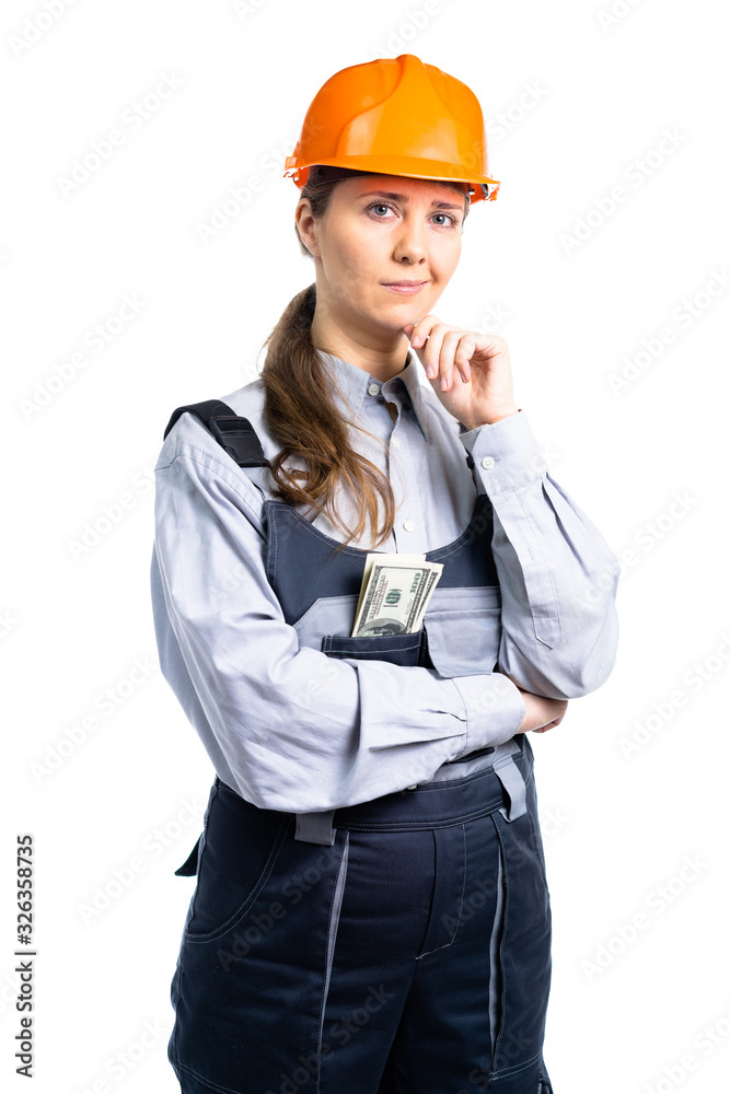 Female construction engineer with dollars in her pocket with a serious look. isolated Female construction engineer with dollars in her pocket with a serious look. isolated