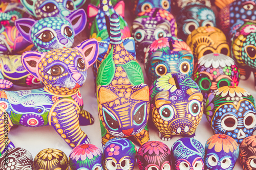 Decorated colorful skulls, ceramics death symbol at market, day of dead, Mexico. © Curioso.Photography