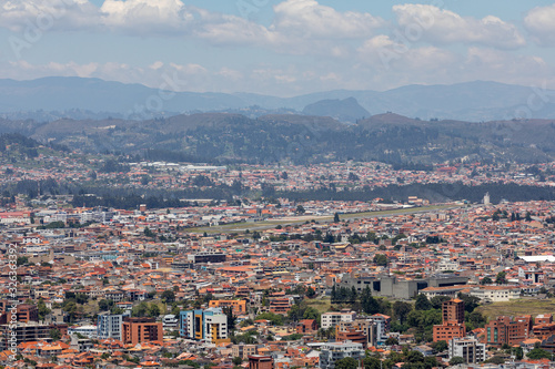 Fototapeta Naklejka Na Ścianę i Meble -  View of the city of Cuenca, Ecuador, with it's many churches at sunny summer day. South America.