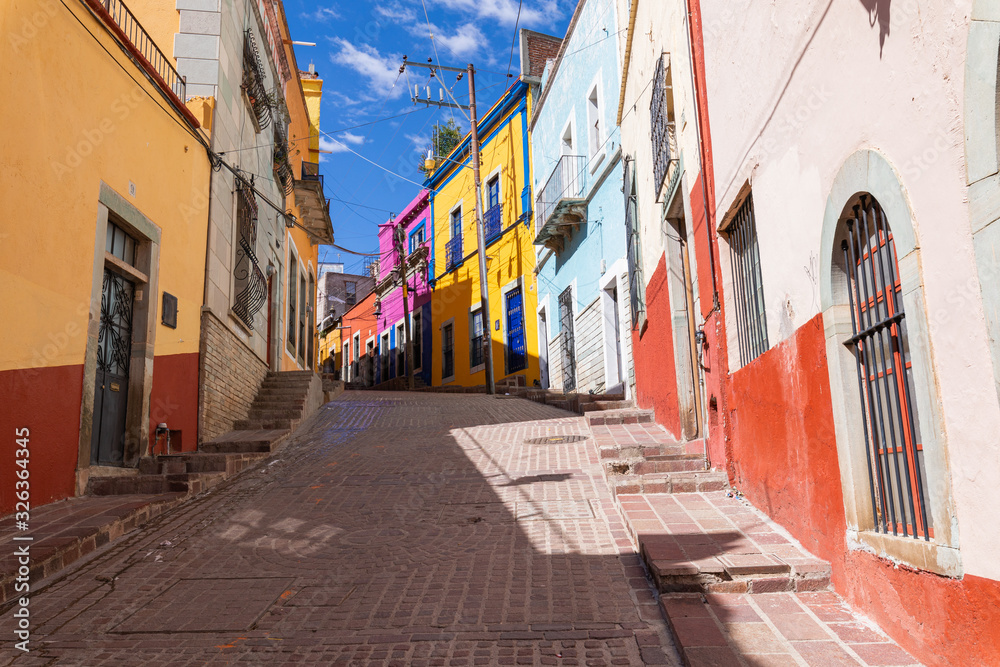 Colored colonial houses in old town of Guanajuato. Colorful alleys and narrow streets in Guanajuato city, Mexico. Spanish Colonial Style. Colored colonial houses in old town of Guanajuato. Colorful alleys and narrow streets in Guanajuato city, Mexico. Spanish Colonial Style.