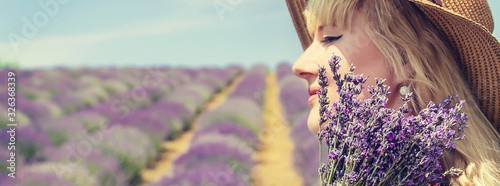 Girl in a flowering field of lavender. Selective focus.