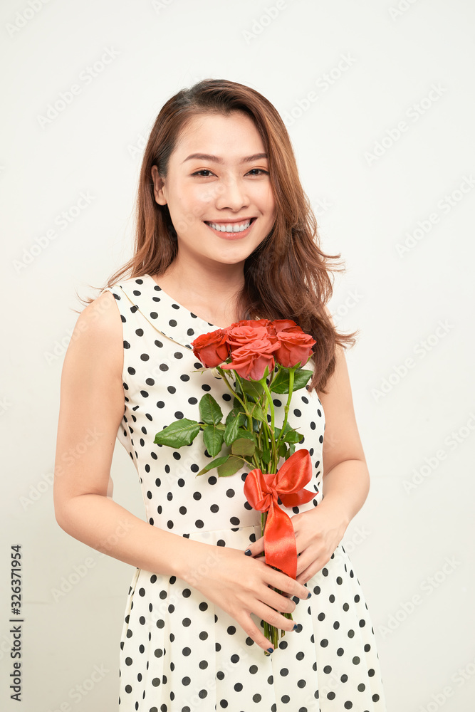 Pretty asian woman holding bunch of roses Pretty asian woman holding bunch of roses