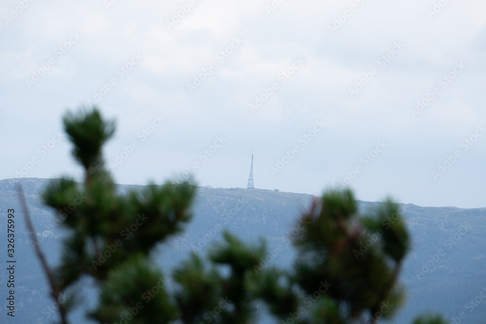 radio tower standing on mountain
