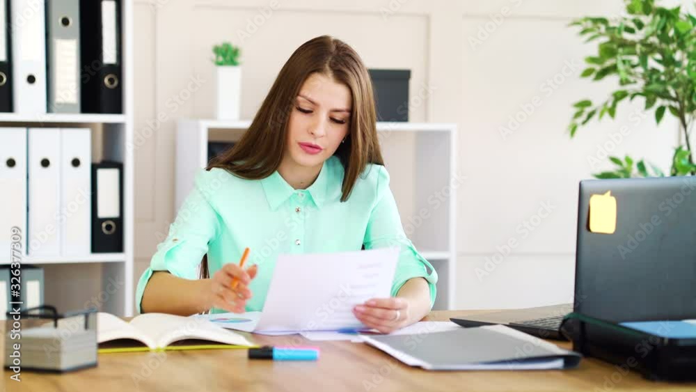 Annoyed business woman crumpling papers and throwing away Annoyed business woman crumpling papers and throwing away